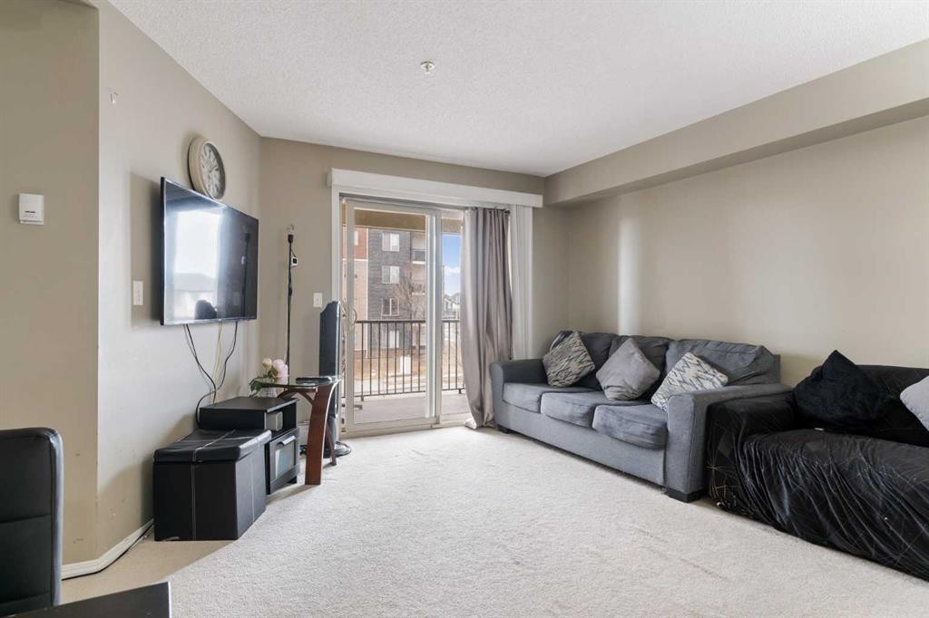 203-5 Saddlestone Way Ne, Calgary, AB - Indoor Photo Showing Living Room