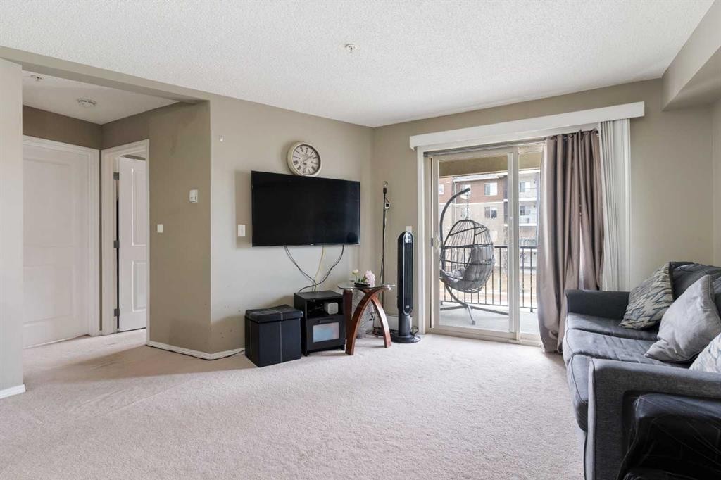 203-5 Saddlestone Way Ne, Calgary, AB - Indoor Photo Showing Living Room