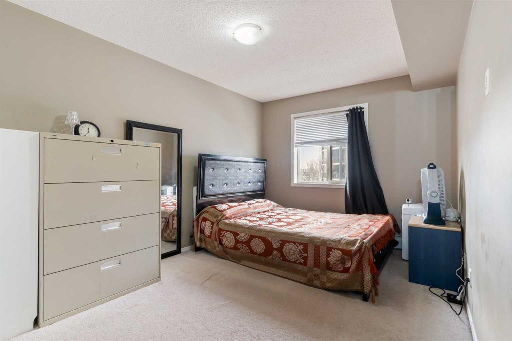 203-5 Saddlestone Way Ne, Calgary, AB - Indoor Photo Showing Bedroom