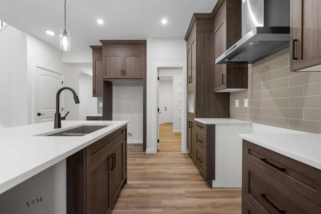 72 Dawson Wharf Mount, Chestermere, AB - Indoor Photo Showing Kitchen With Double Sink With Upgraded Kitchen