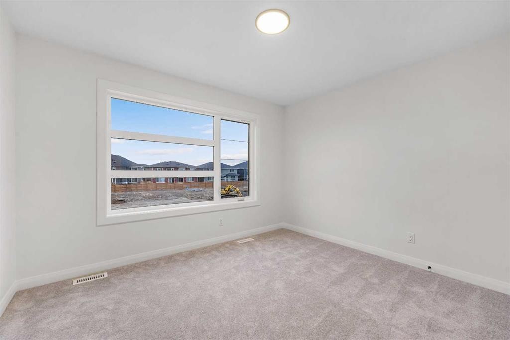 72 Dawson Wharf Mount, Chestermere, AB - Indoor Photo Showing Other Room