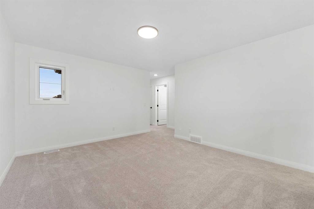 72 Dawson Wharf Mount, Chestermere, AB - Indoor Photo Showing Other Room