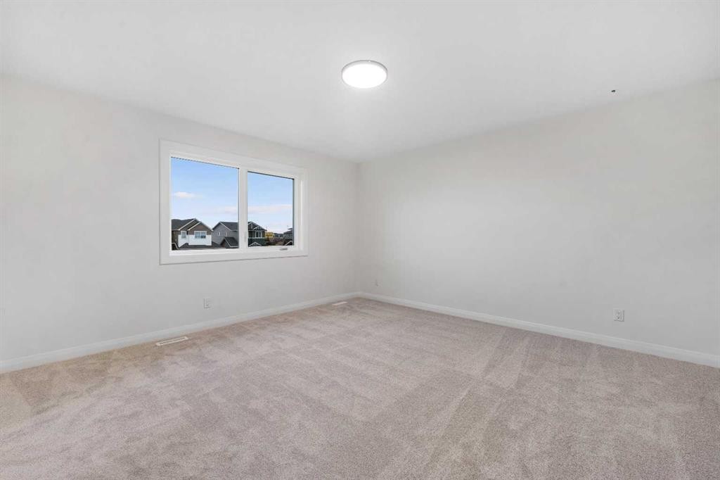 72 Dawson Wharf Mount, Chestermere, AB - Indoor Photo Showing Other Room