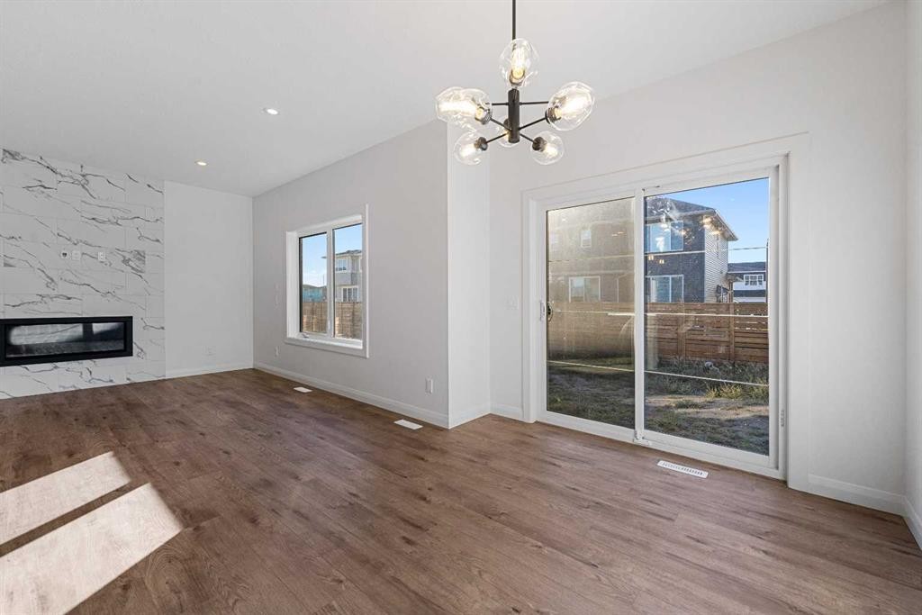 95 Dawson Wharf Mount, Chestermere, AB - Indoor Photo Showing Other Room With Fireplace