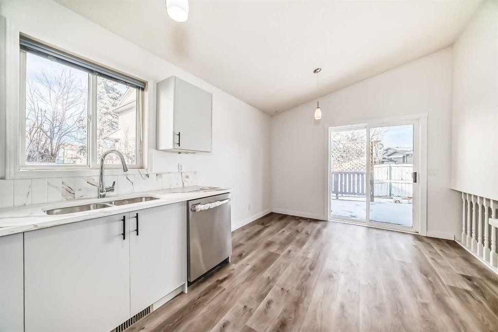 16218 Shawbrooke Road Sw, Calgary, AB - Indoor Photo Showing Kitchen With Double Sink