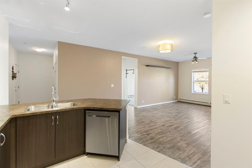 105-100 Cranfield Common Se, Calgary, AB - Indoor Photo Showing Kitchen With Double Sink