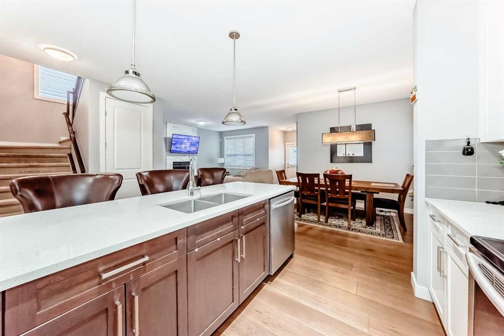 512 Baysprings Lane Sw, Airdrie, AB - Indoor Photo Showing Kitchen With Double Sink