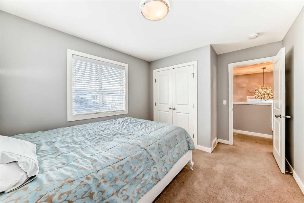 512 Baysprings Lane Sw, Airdrie, AB - Indoor Photo Showing Bedroom