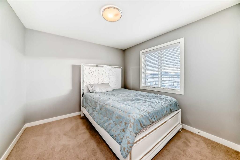 512 Baysprings Lane Sw, Airdrie, AB - Indoor Photo Showing Bedroom