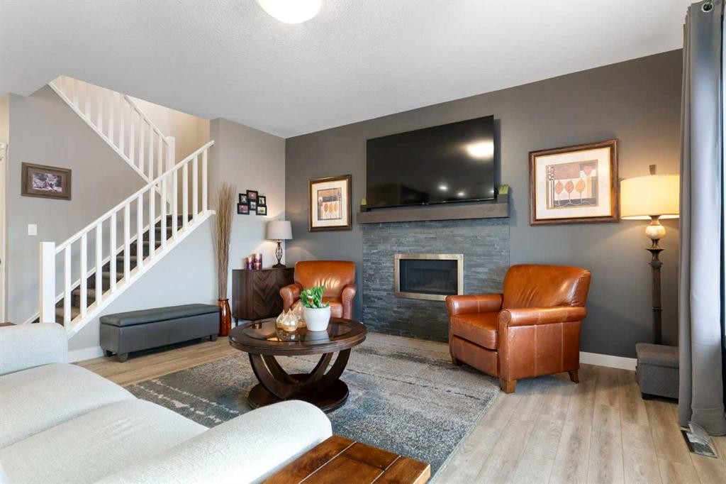 67 Fireside Terrace, Cochrane, AB - Indoor Photo Showing Living Room With Fireplace