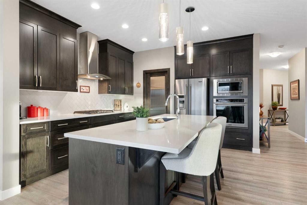67 Fireside Terrace, Cochrane, AB - Indoor Photo Showing Kitchen With Upgraded Kitchen