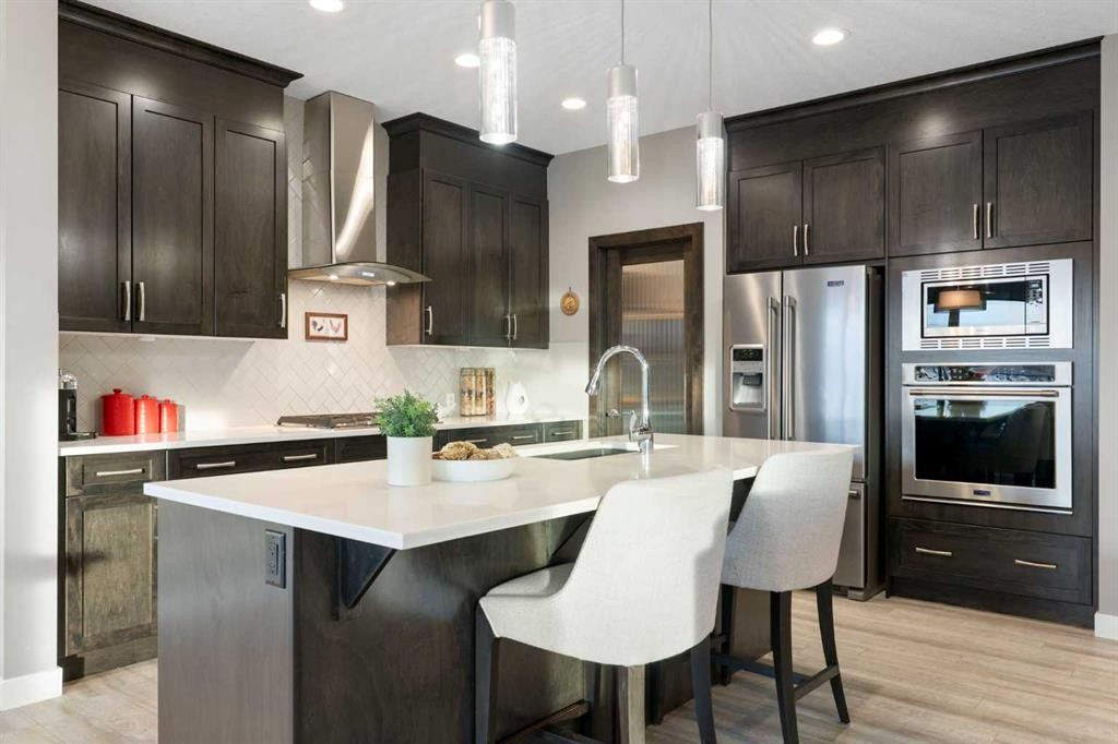 67 Fireside Terrace, Cochrane, AB - Indoor Photo Showing Kitchen With Upgraded Kitchen