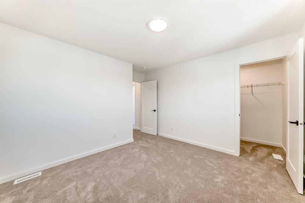 63 Creekside Path Sw, Calgary, AB - Indoor Photo Showing Other Room