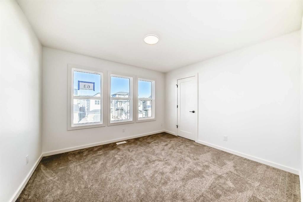 63 Creekside Path Sw, Calgary, AB - Indoor Photo Showing Other Room
