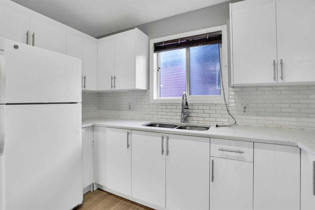 1134 Martindale Boulevard Ne, Calgary, AB - Indoor Photo Showing Kitchen With Double Sink