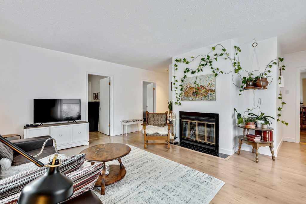 411 Mountain View Place, Longview, AB - Indoor Photo Showing Living Room With Fireplace