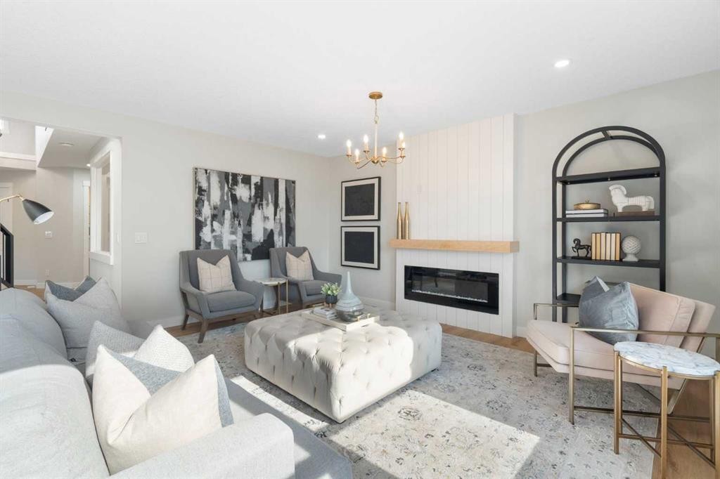 335 Hidden Creek Boulevard Nw, Calgary, AB - Indoor Photo Showing Living Room With Fireplace