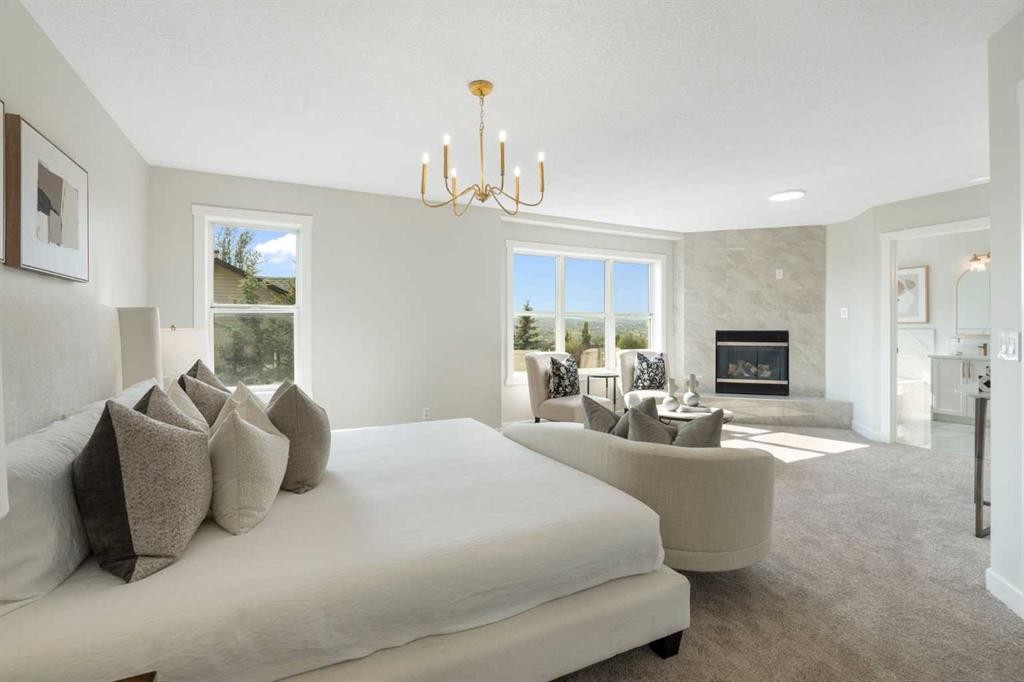 335 Hidden Creek Boulevard Nw, Calgary, AB - Indoor Photo Showing Bedroom With Fireplace