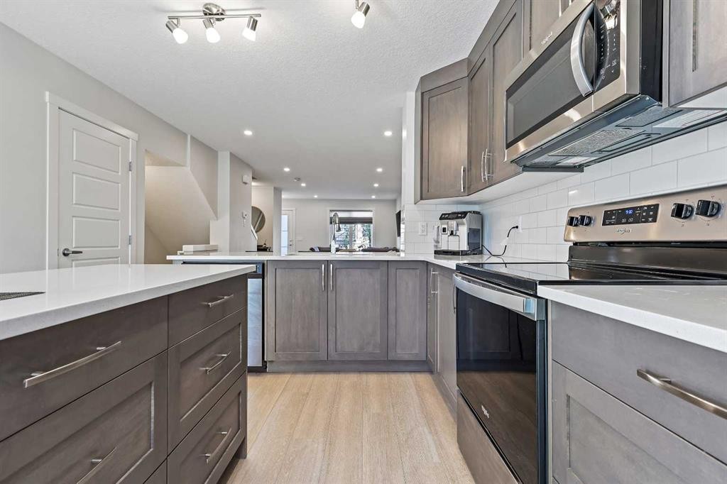107-474 Seton Circle Se, Calgary, AB - Indoor Photo Showing Kitchen With Upgraded Kitchen