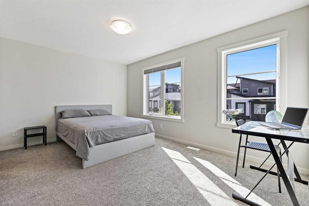 107-474 Seton Circle Se, Calgary, AB - Indoor Photo Showing Bedroom