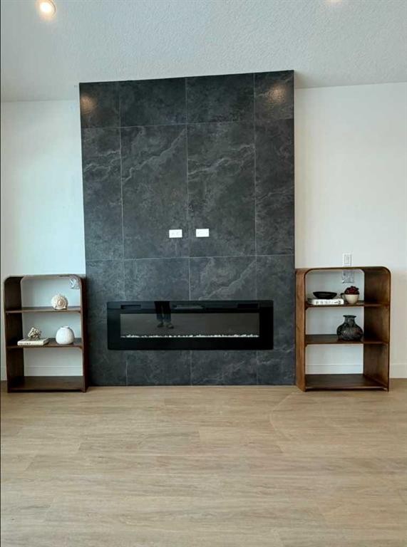 24 St Andrews Close, Lyalta, AB - Indoor Photo Showing Other Room With Fireplace