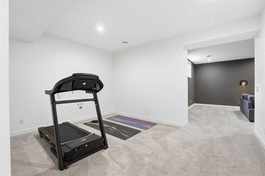 65 Rowmont Link Nw, Calgary, AB - Indoor Photo Showing Gym Room