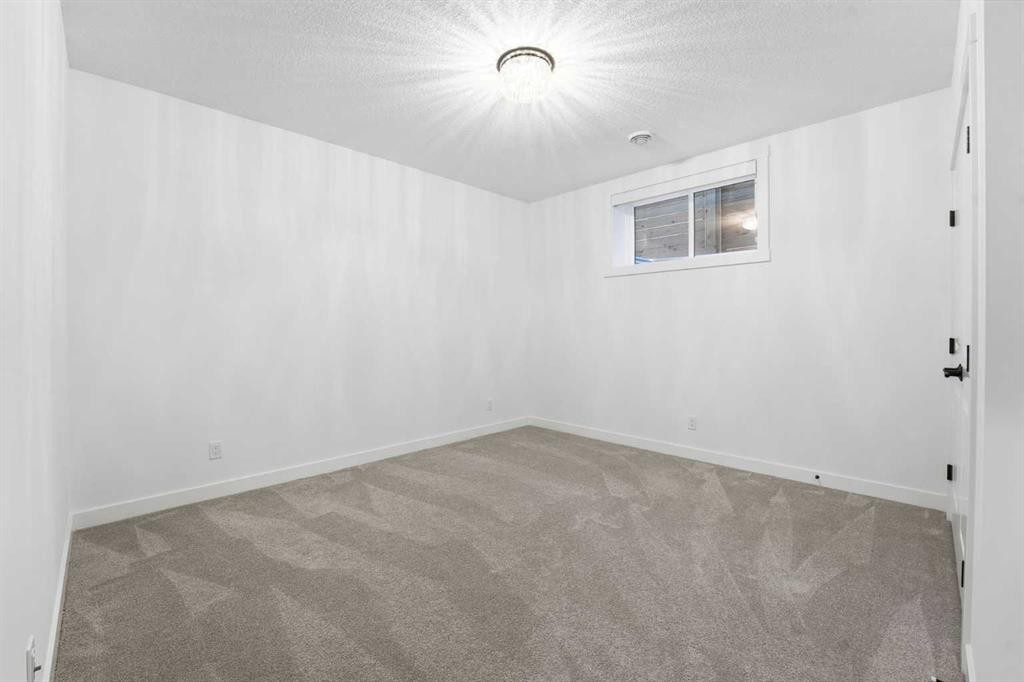 65 Rowmont Link Nw, Calgary, AB - Indoor Photo Showing Other Room
