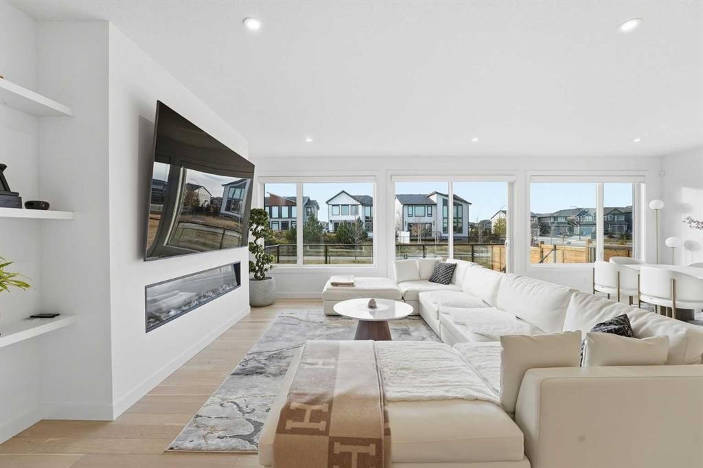 65 Rowmont Link Nw, Calgary, AB - Indoor Photo Showing Living Room With Fireplace