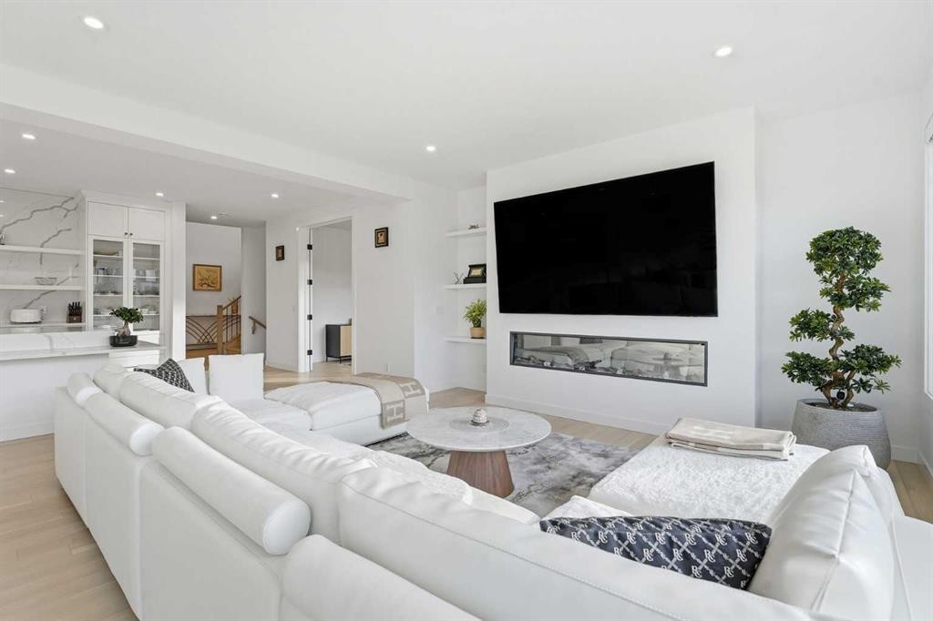 65 Rowmont Link Nw, Calgary, AB - Indoor Photo Showing Living Room With Fireplace