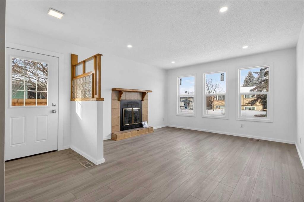 3283 Dover Ridge Drive Se, Calgary, AB - Indoor Photo Showing Living Room With Fireplace