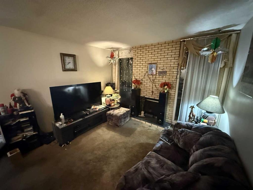 24 Bermuda Road Nw, Calgary, AB - Indoor With Fireplace