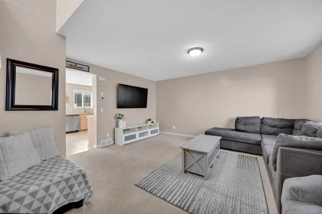 26 Saddlemead Close Ne, Calgary, AB - Indoor Photo Showing Living Room