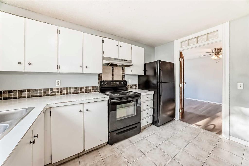 63 Falshire Place Ne, Calgary, AB - Indoor Photo Showing Kitchen With Double Sink