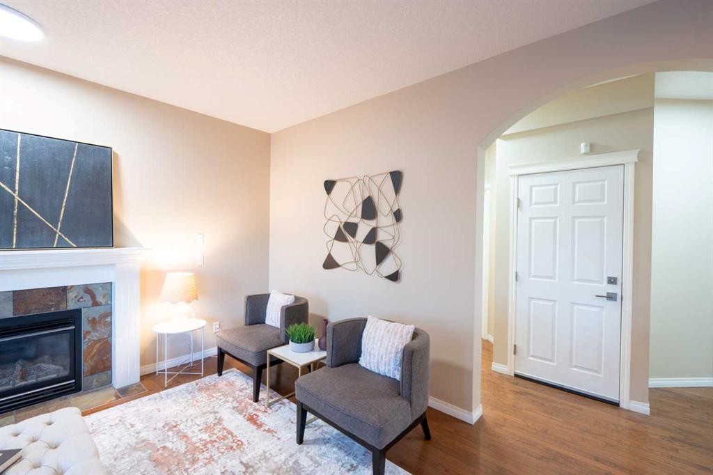 306 Rockyspring Circle Nw, Calgary, AB - Indoor Photo Showing Living Room With Fireplace