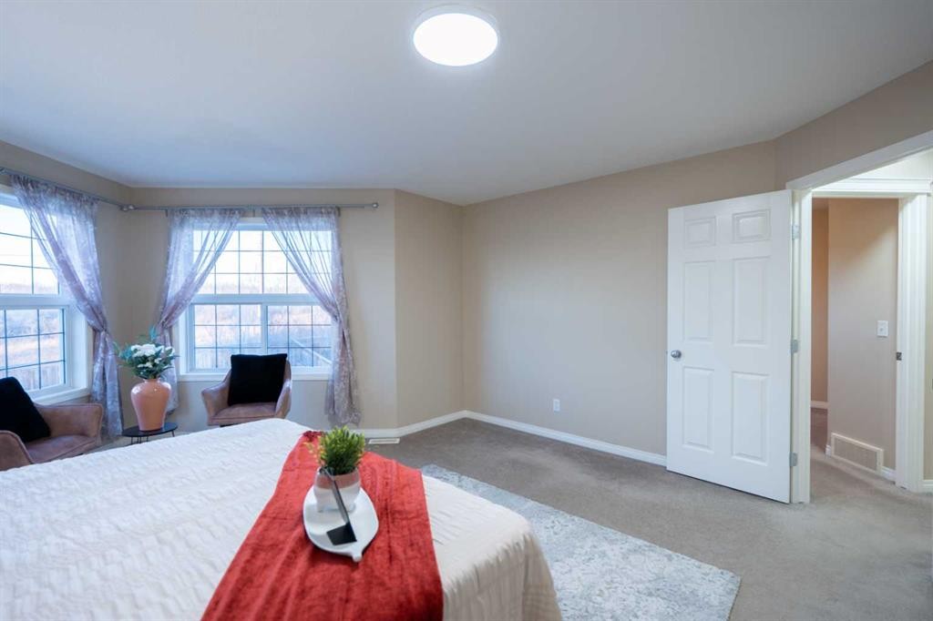 306 Rockyspring Circle Nw, Calgary, AB - Indoor Photo Showing Bedroom