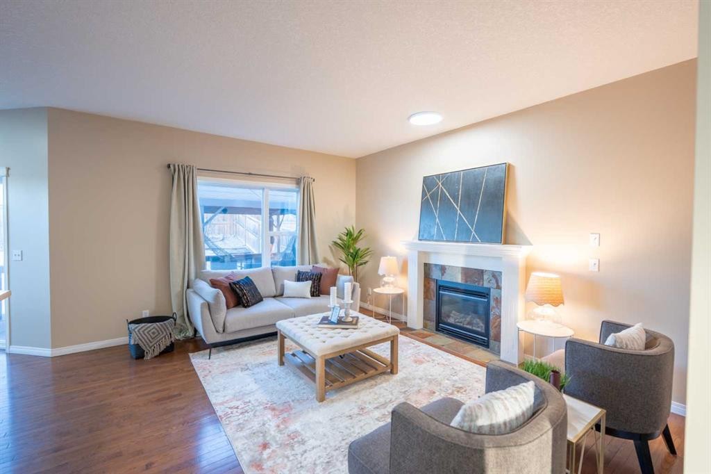 306 Rockyspring Circle Nw, Calgary, AB - Indoor Photo Showing Living Room With Fireplace