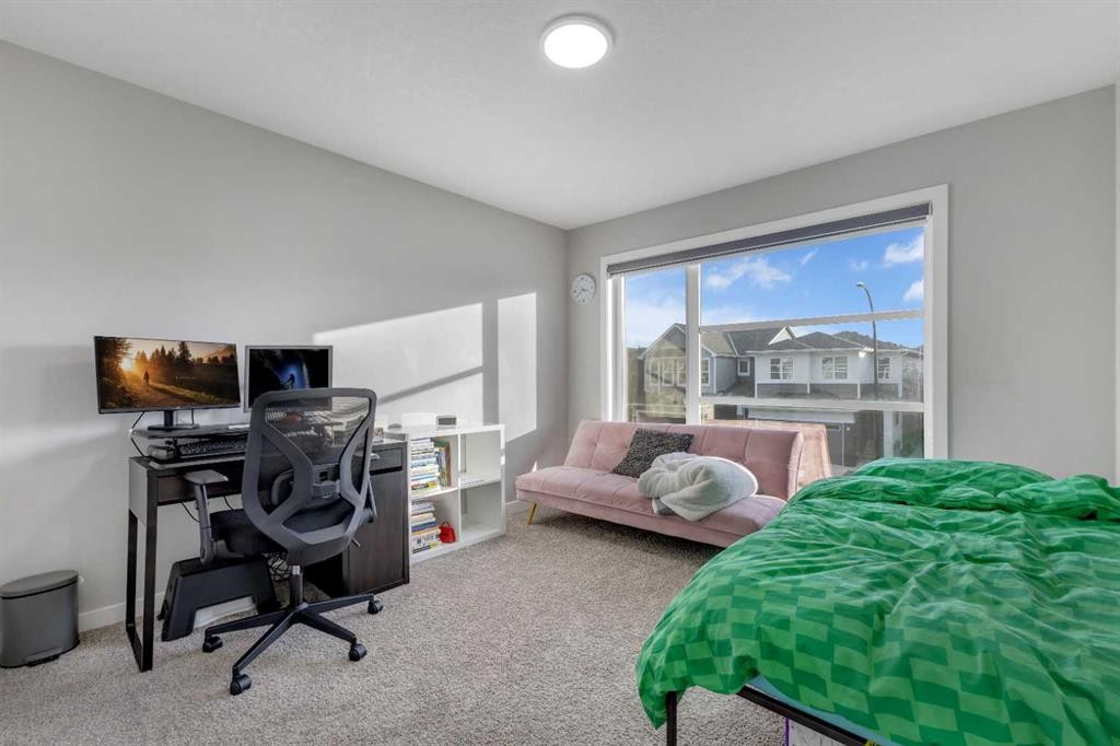 704 Creekstone Circle Sw, Calgary, AB - Indoor Photo Showing Bedroom