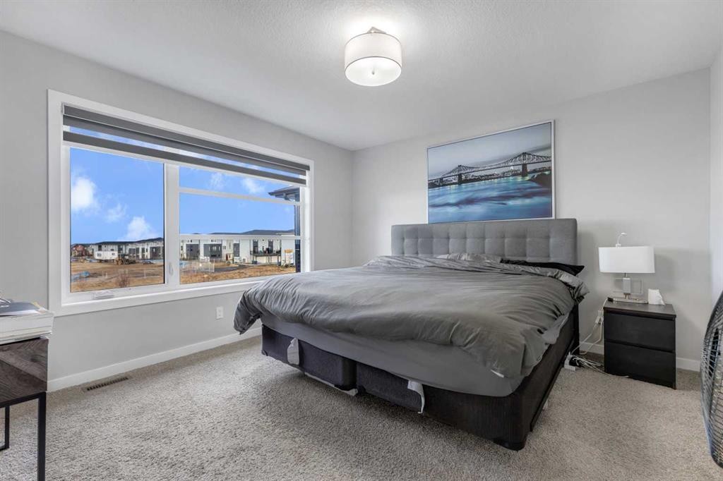 704 Creekstone Circle Sw, Calgary, AB - Indoor Photo Showing Bedroom