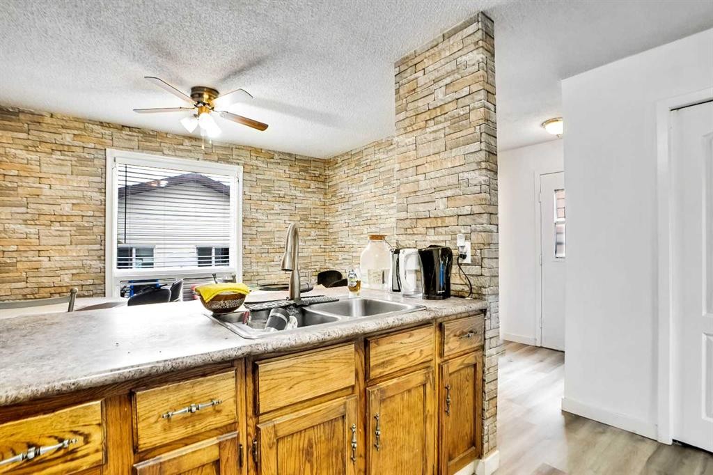48 Templeridge Crescent Ne, Calgary, AB - Indoor Photo Showing Kitchen With Double Sink