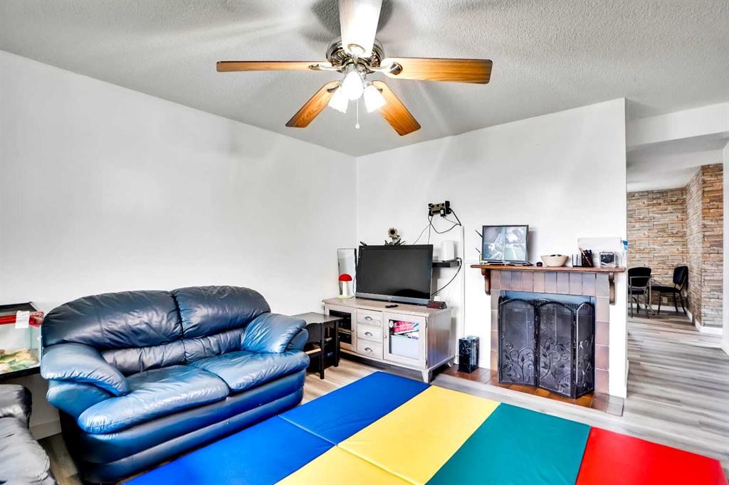 48 Templeridge Crescent Ne, Calgary, AB - Indoor Photo Showing Living Room With Fireplace