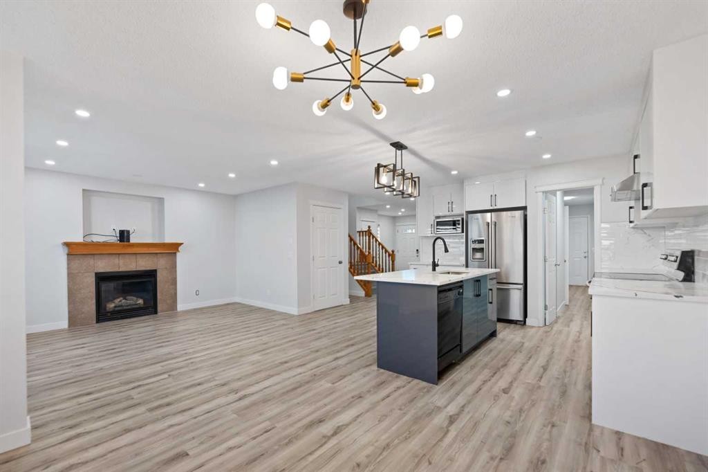154 Taralake Way Ne, Calgary, AB - Indoor Photo Showing Kitchen With Fireplace