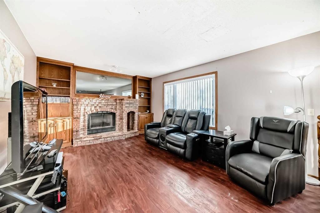 78 Sandringham Way Nw, Calgary, AB - Indoor Photo Showing Living Room With Fireplace