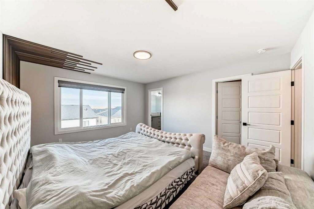 69 Amblehurst Way Nw, Calgary, AB - Indoor Photo Showing Bedroom