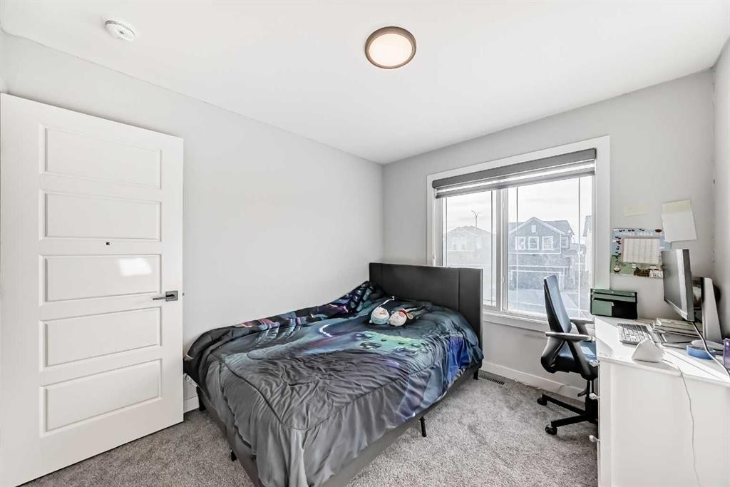 69 Amblehurst Way Nw, Calgary, AB - Indoor Photo Showing Bedroom