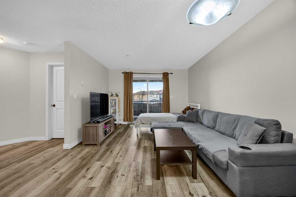 207-5 Saddlestone Way Ne, Calgary, AB - Indoor Photo Showing Living Room
