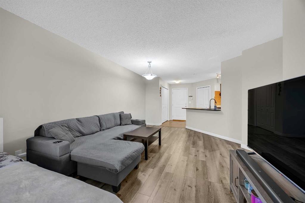 207-5 Saddlestone Way Ne, Calgary, AB - Indoor Photo Showing Living Room