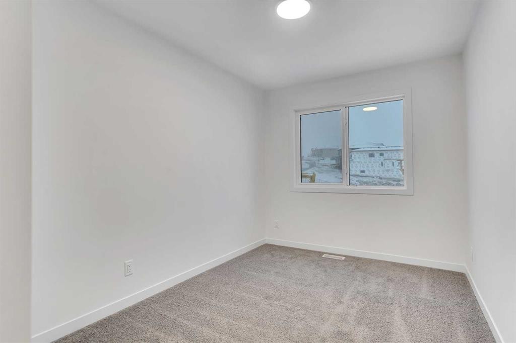 35 Heritage Heath, Cochrane, AB - Indoor Photo Showing Other Room