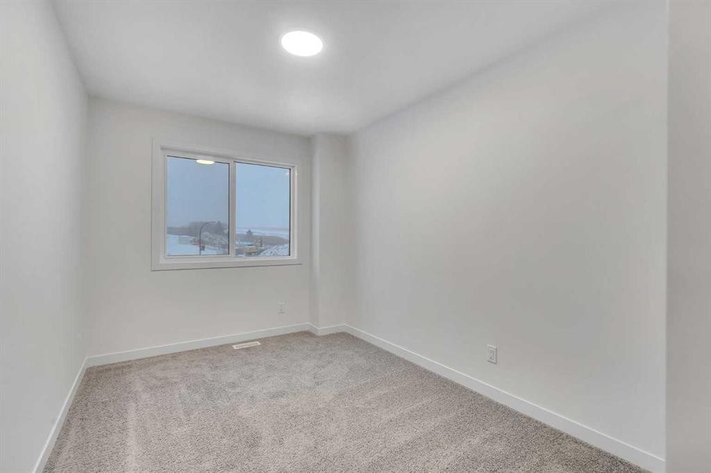 35 Heritage Heath, Cochrane, AB - Indoor Photo Showing Other Room