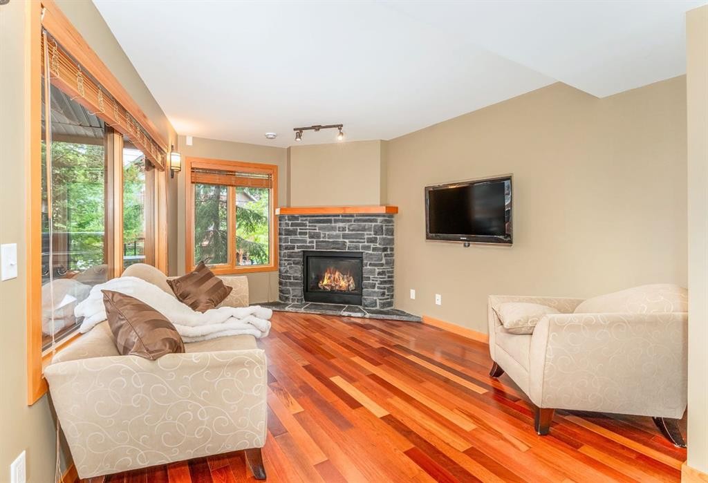 2-722 3Rd Street, Canmore, AB - Indoor Photo Showing Living Room With Fireplace