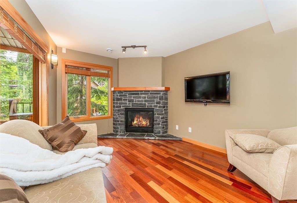 2-722 3Rd Street, Canmore, AB - Indoor Photo Showing Living Room With Fireplace